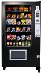 Combo vending machine with snacks and drinks in a Walker, MI industrial breakroom